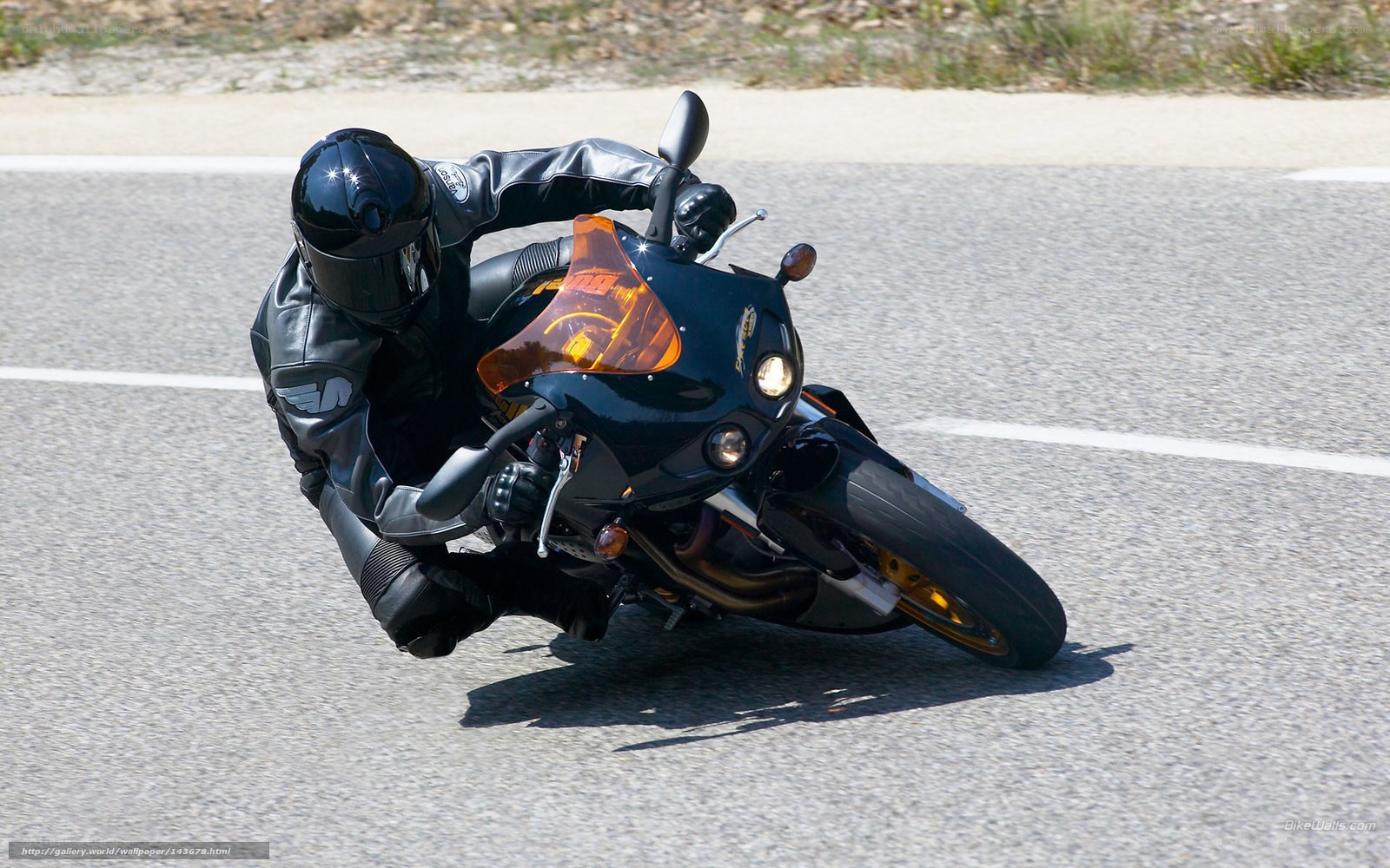 motorcyclist leaning in turn
