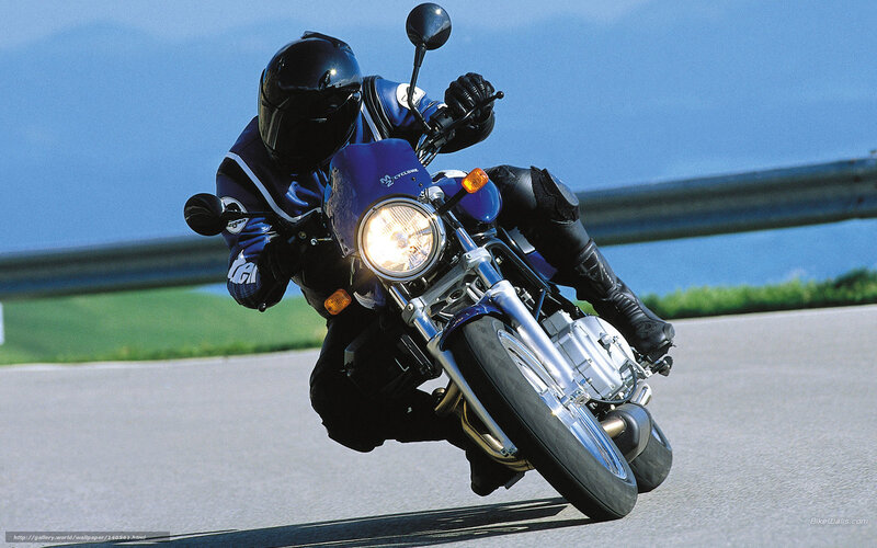 Motorcyclist leaning into a turn