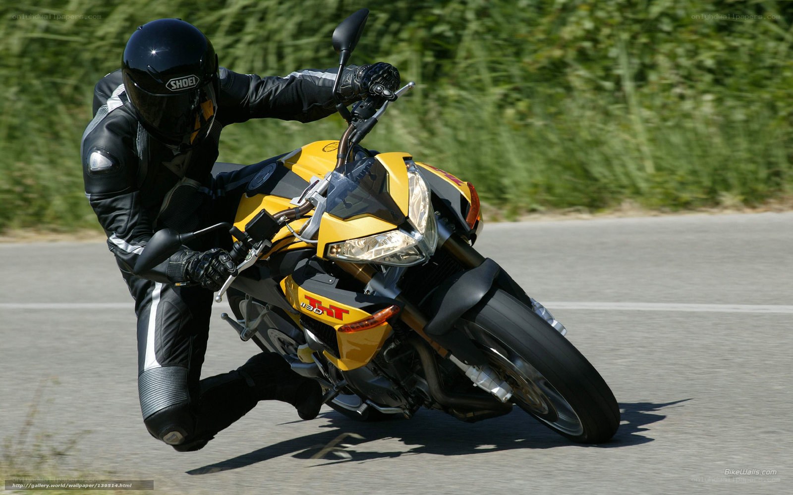 Motorcyclist leaning into a turn