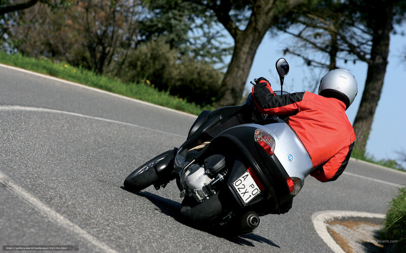motorcyclist leaning on curve