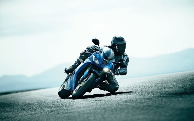 Motorcyclist on a blue bike