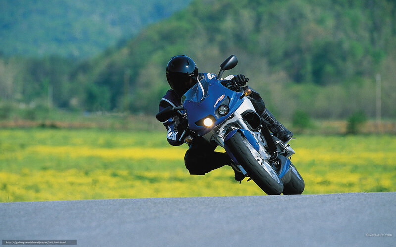 Motorcyclist on a blue bike