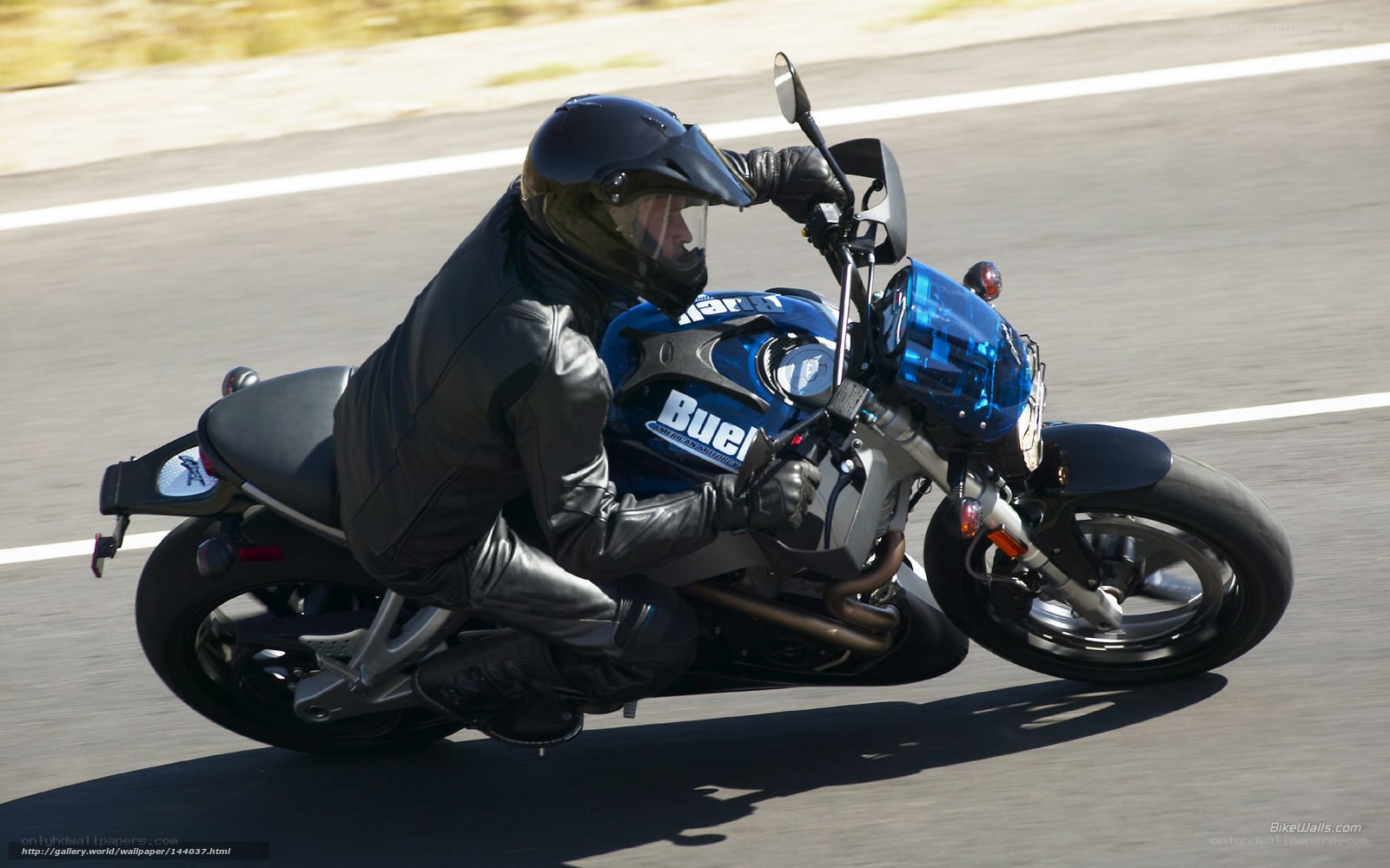 motorcyclist on a blue bike