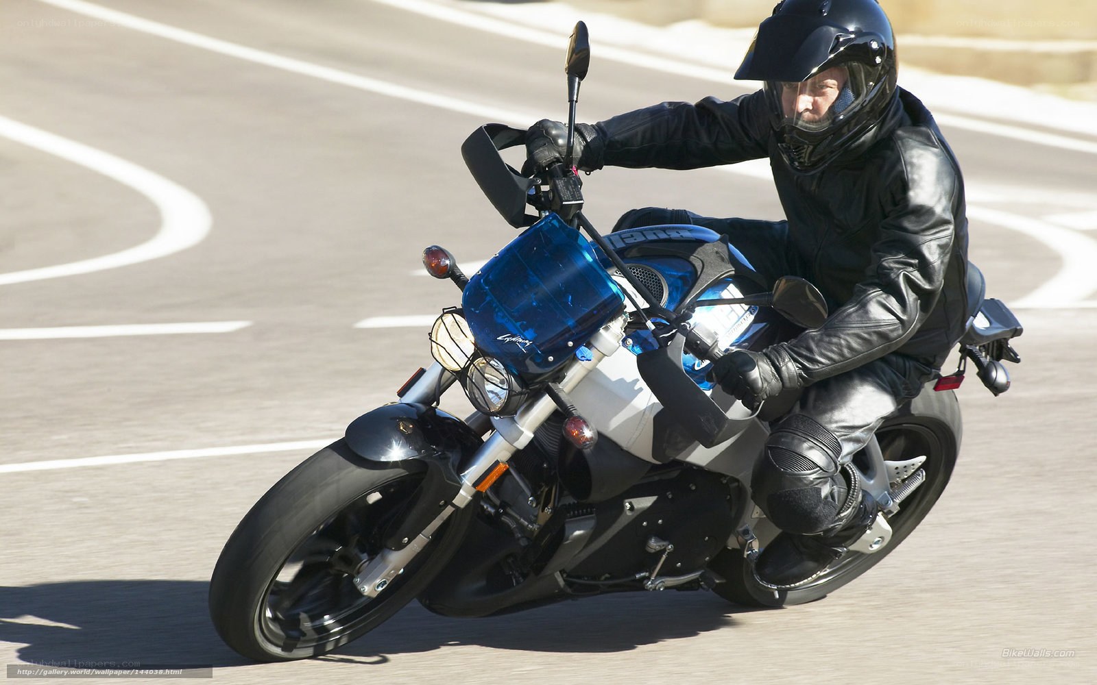 motorcyclist on a blue bike