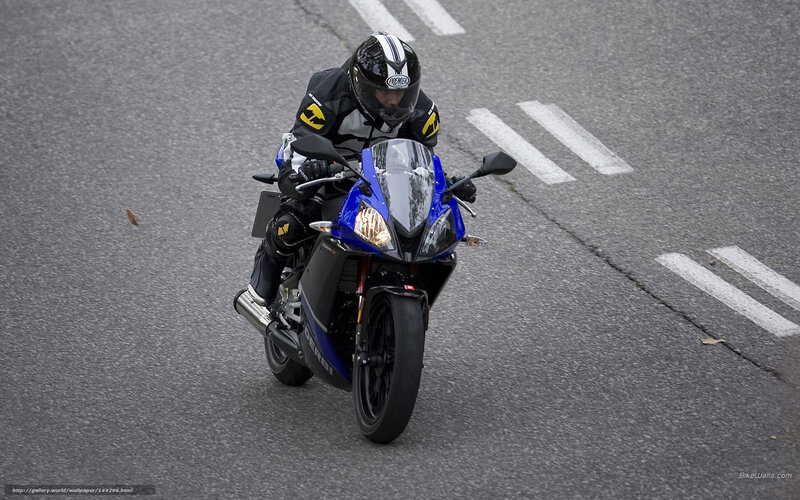 motorcyclist on a blue bike
