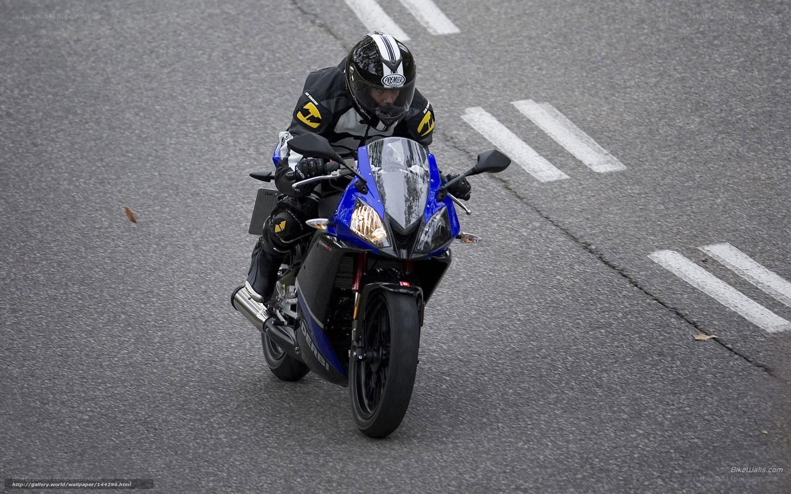 motorcyclist on a blue bike