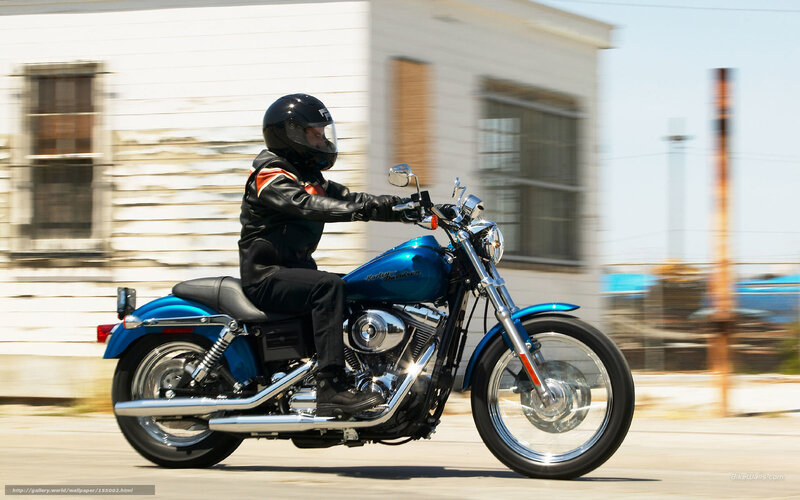 Motorcyclist on a blue bike