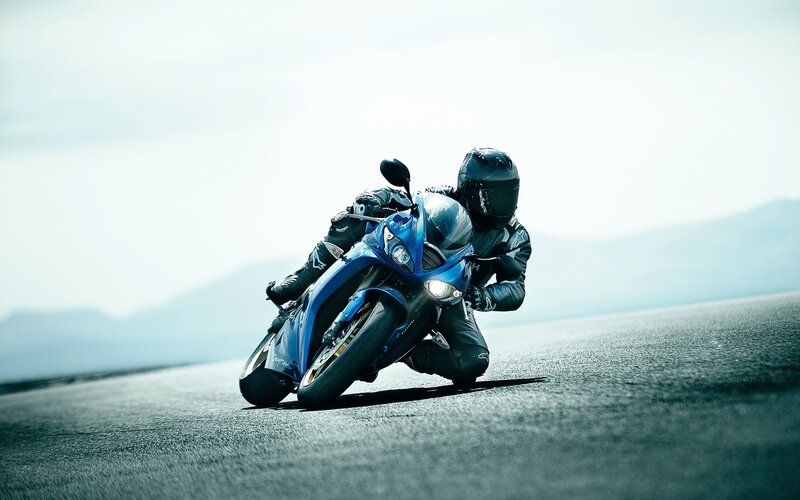 Motorcyclist on a blue bike