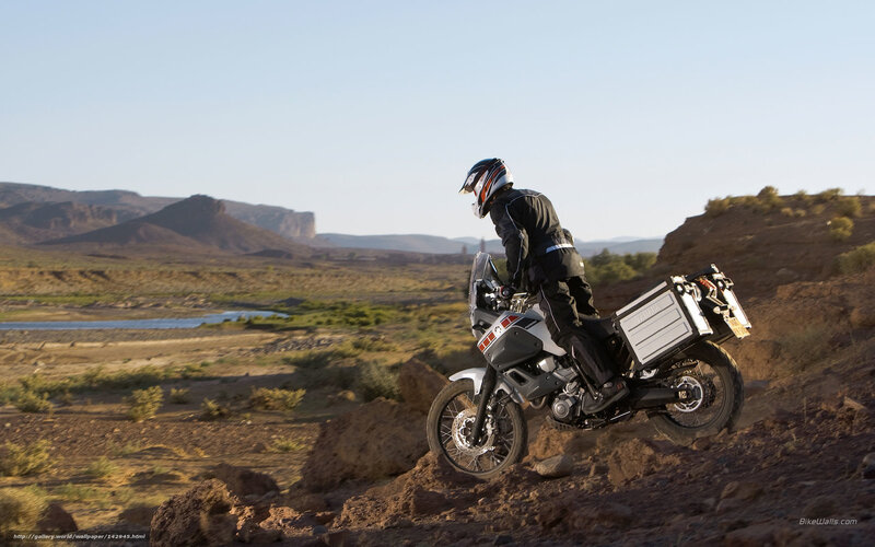 Motorcyclist on a desert trail