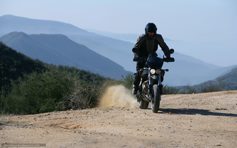 Motorcyclist on a dirt road