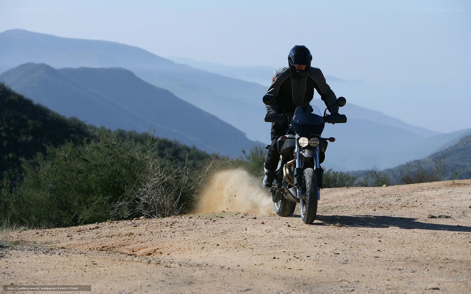 Motorcyclist on a dirt road