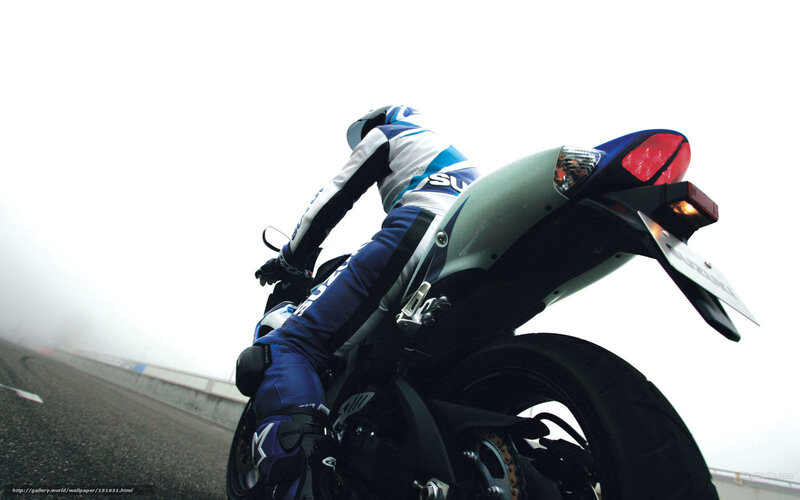 motorcyclist on a foggy road