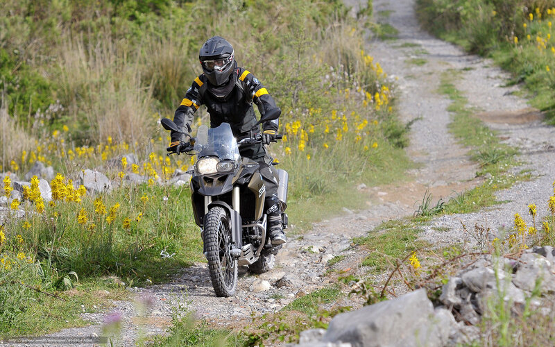 Motorcyclist on a gravel path
