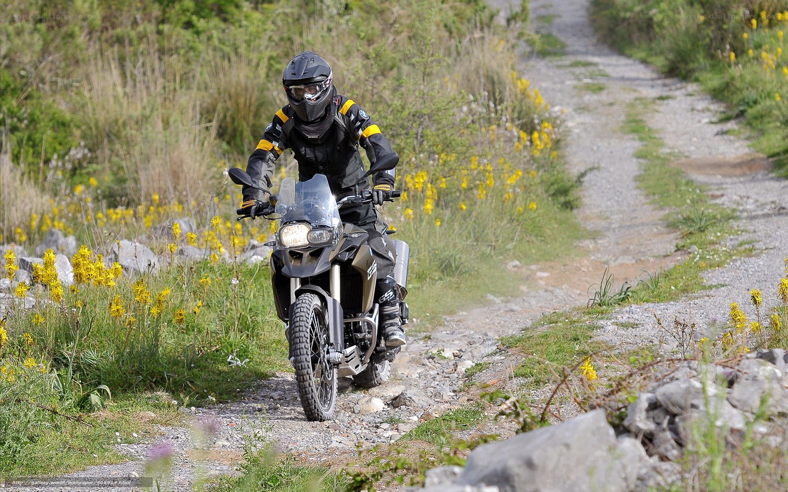 Motorcyclist on a gravel path