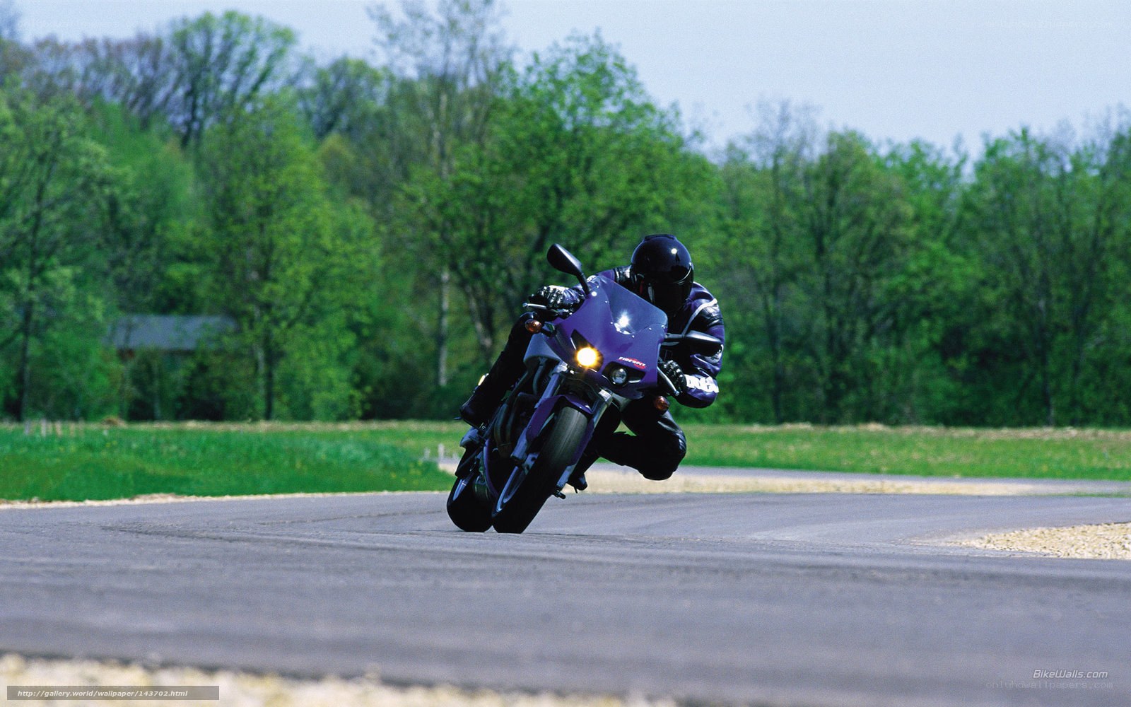 motorcyclist on a purple bike
