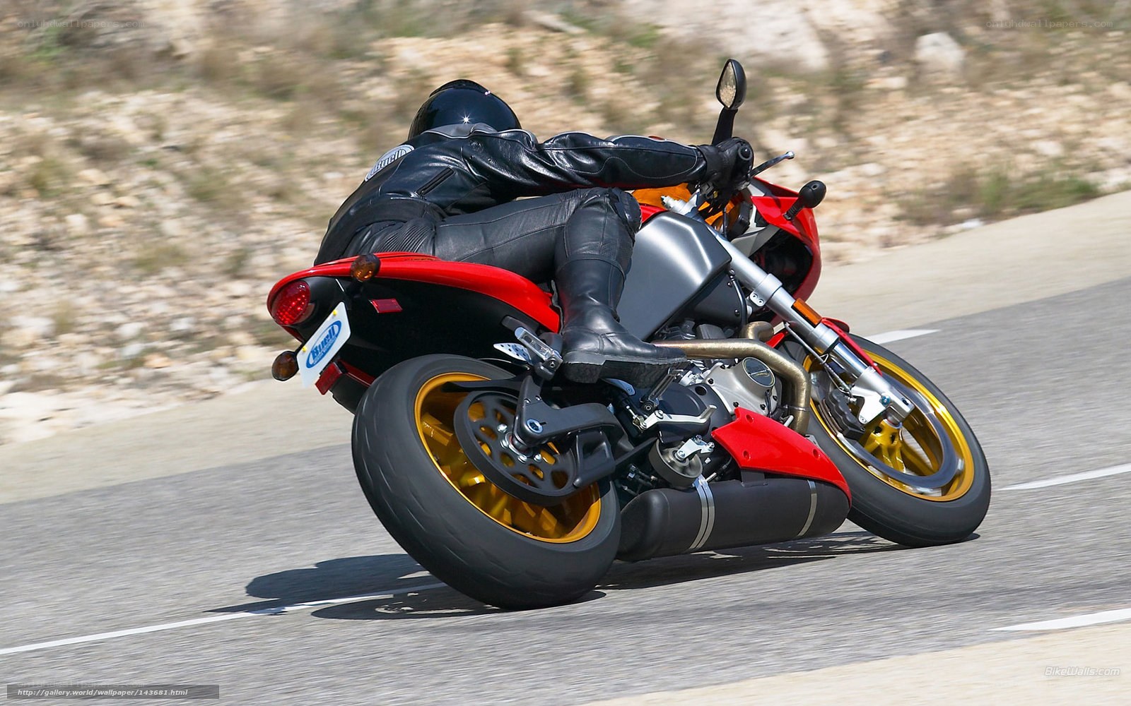 motorcyclist on a red bike
