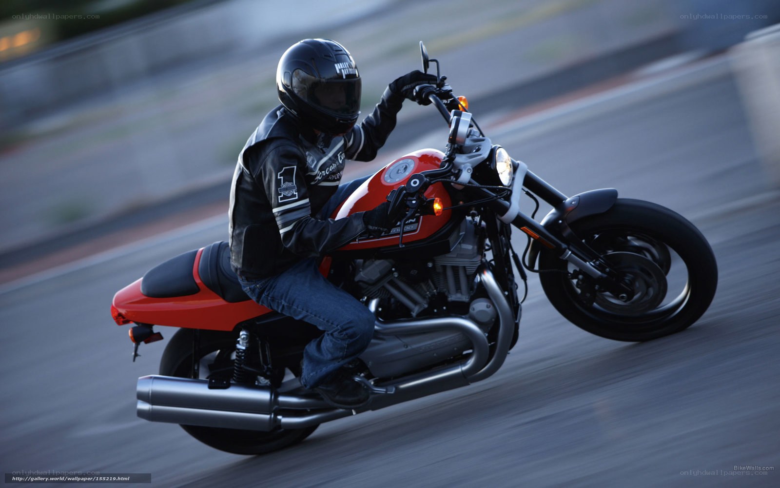 motorcyclist on a red bike