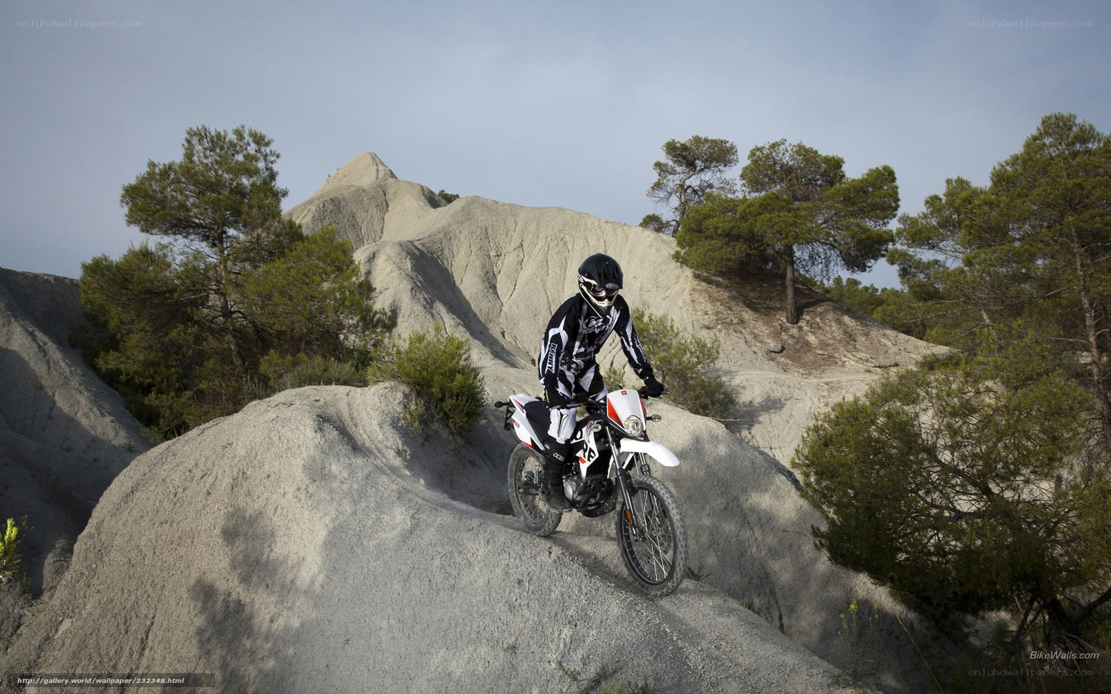 Motorcyclist on a rocky trail