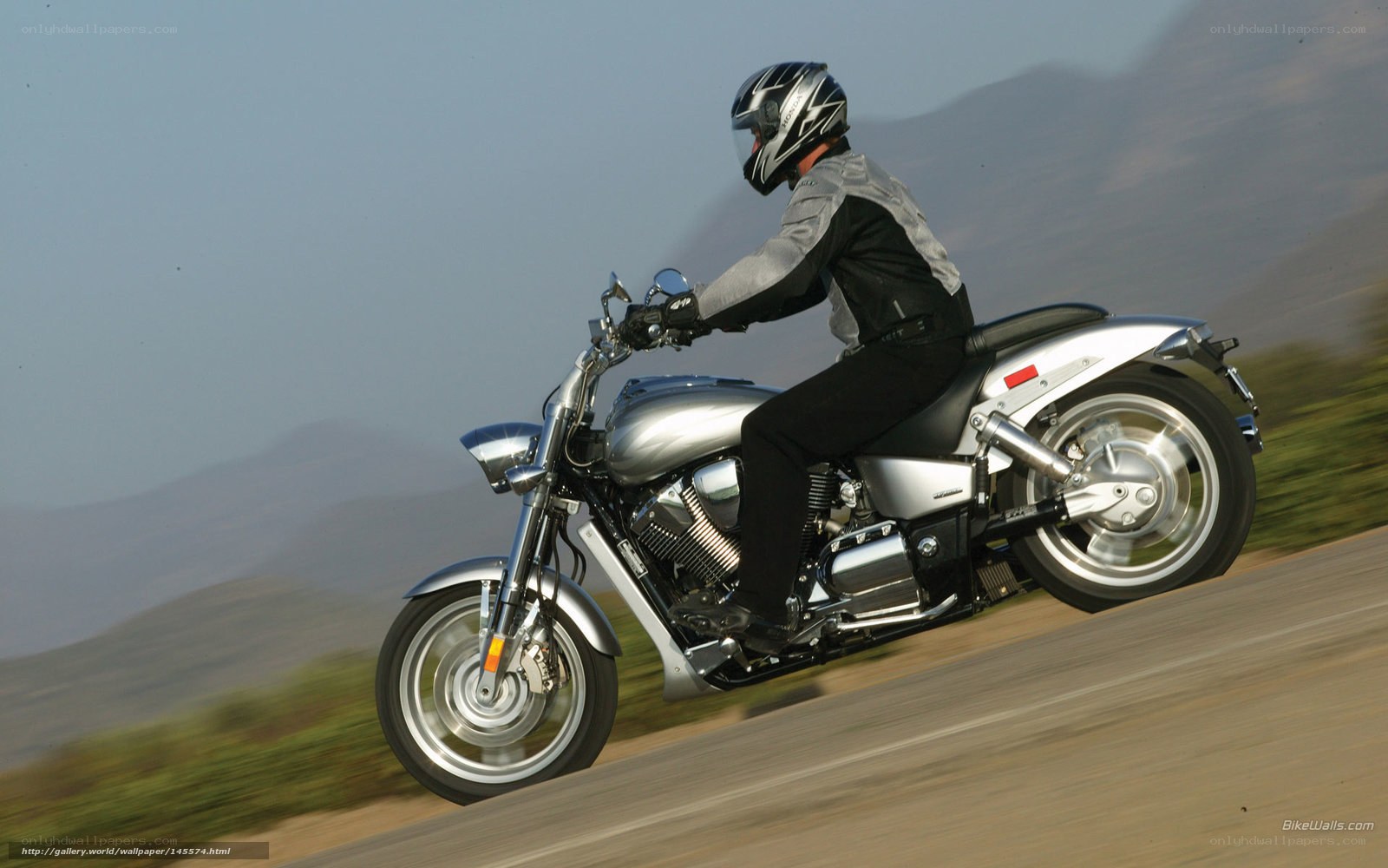 motorcyclist on a silver bike