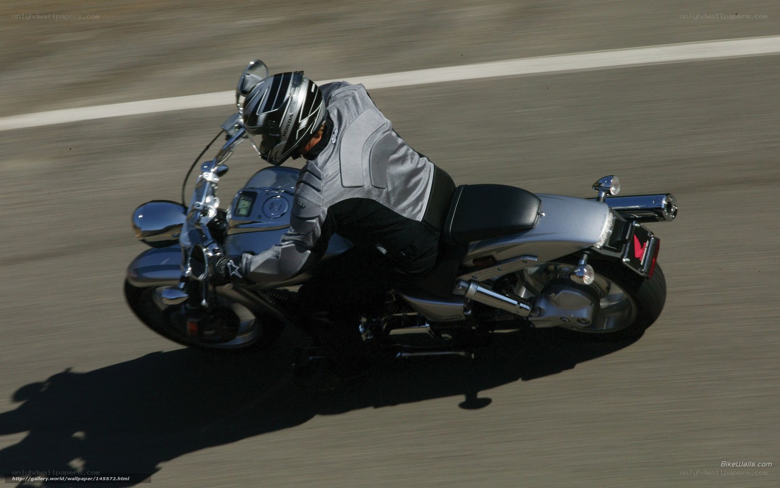 Motorcyclist on a silver bike