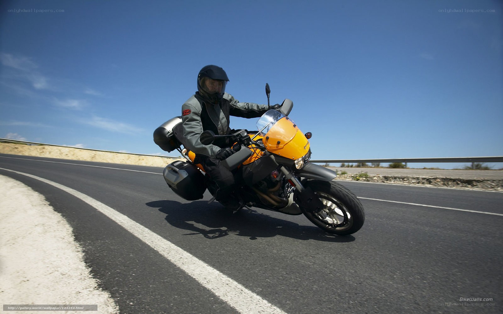 Motorcyclist on a sunny road