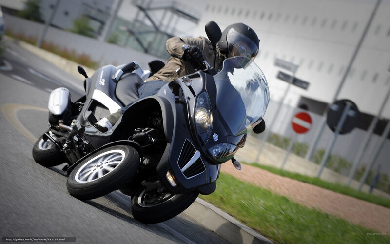 motorcyclist on a three-wheeled scooter