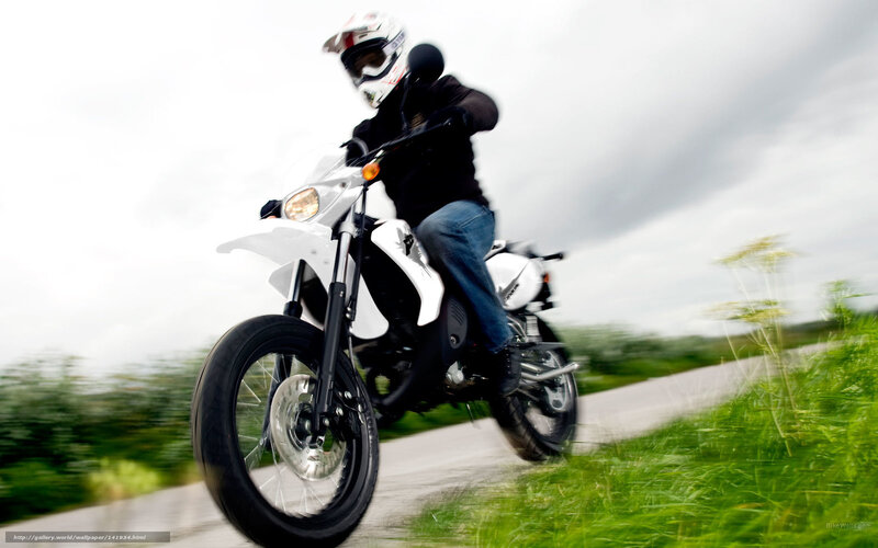 motorcyclist on a white bike