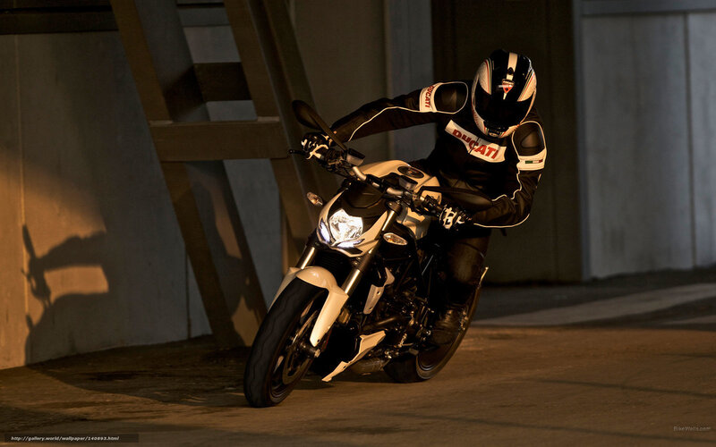 Motorcyclist on a white bike