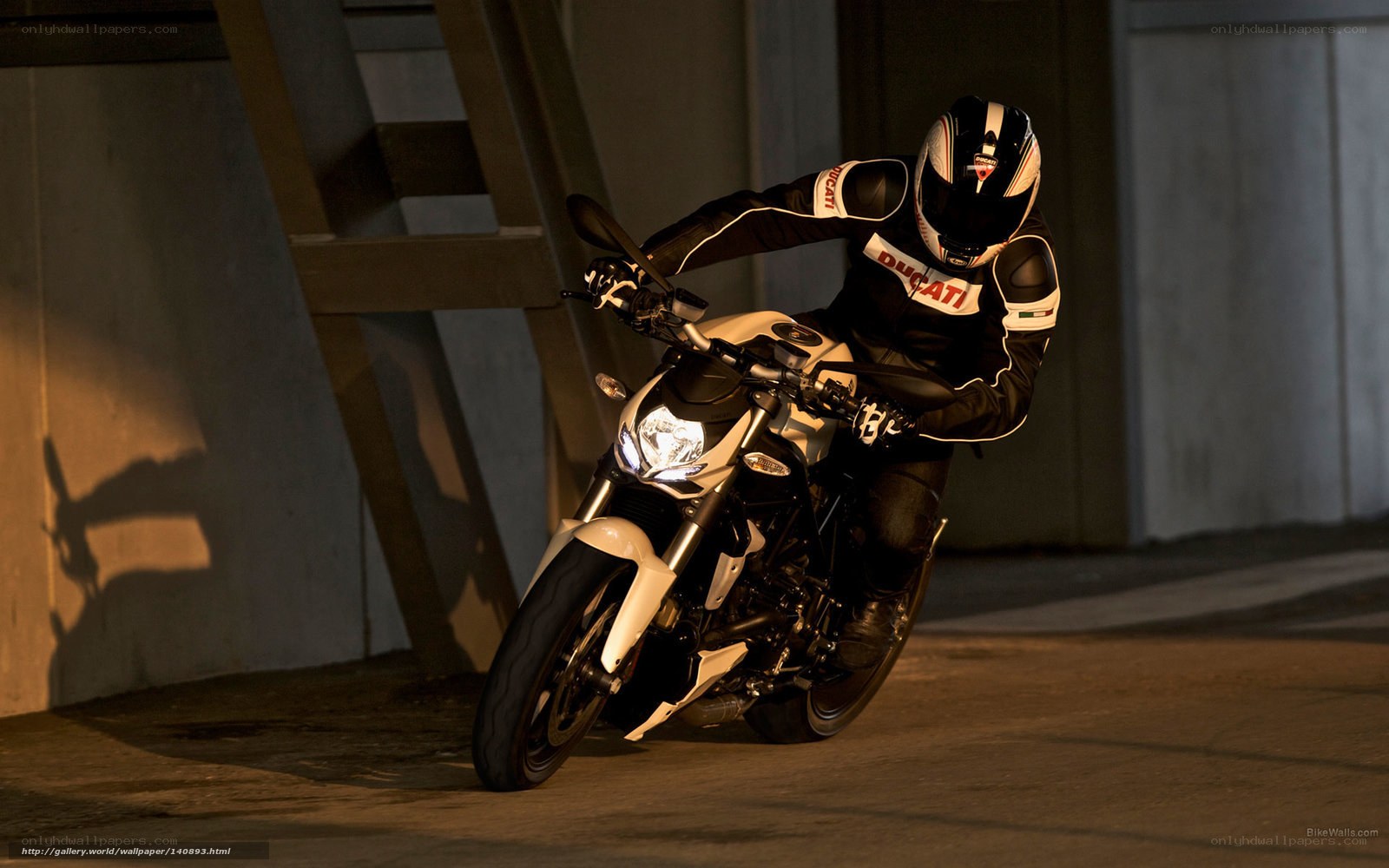 Motorcyclist on a white bike