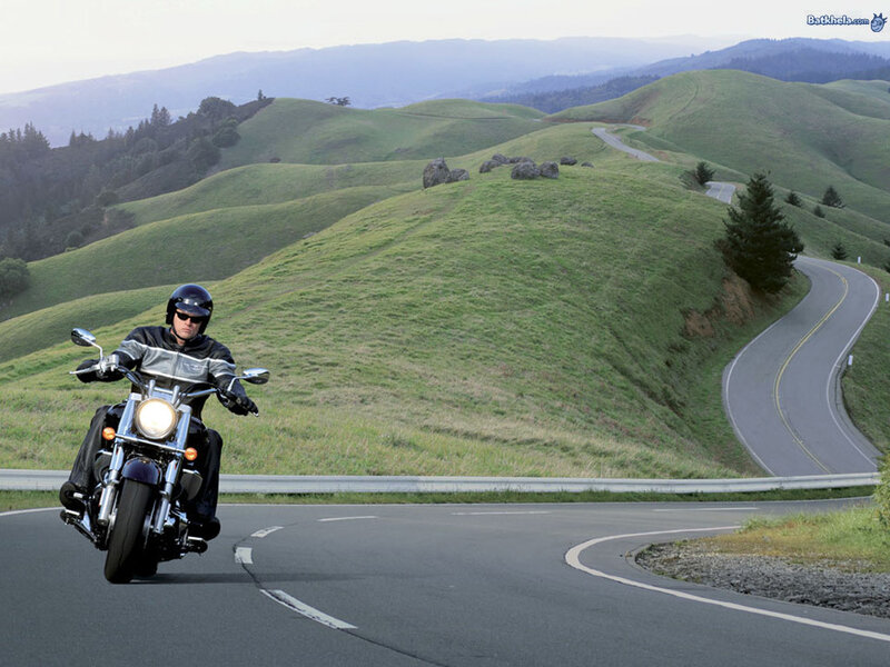 Motorcyclist on a winding road
