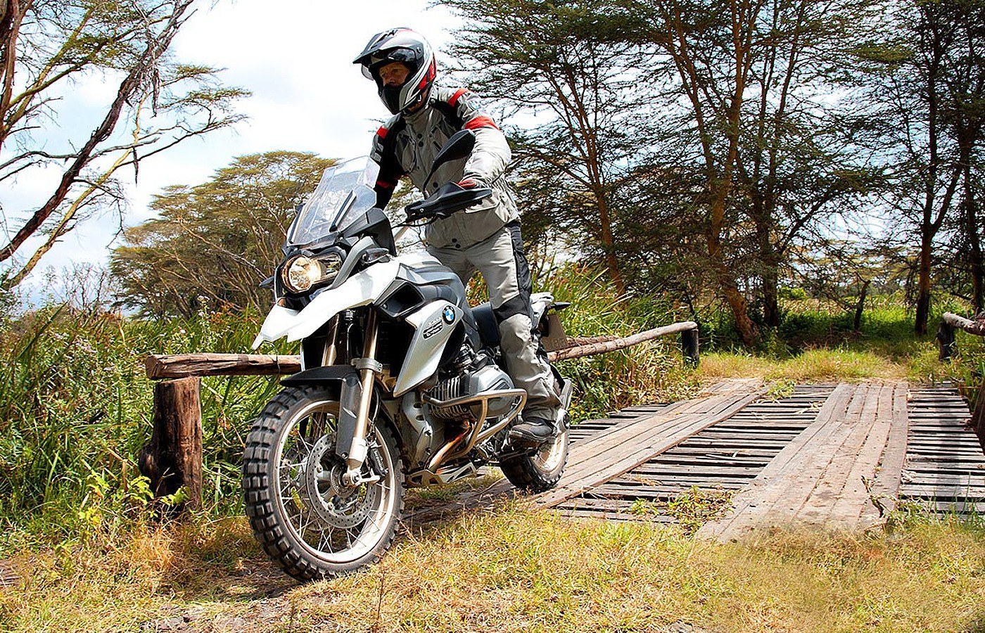 Motorcyclist on a wooden bridge