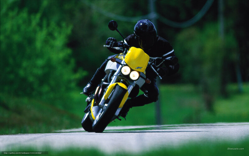 Motorcyclist on a yellow bike