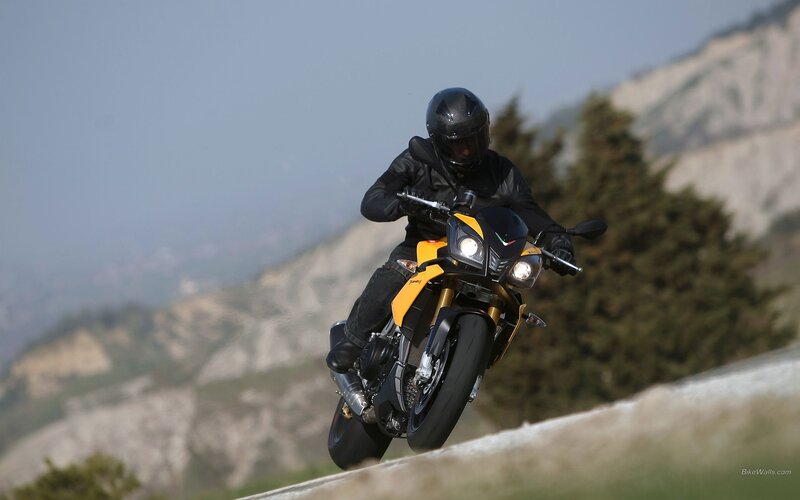 motorcyclist on a yellow bike