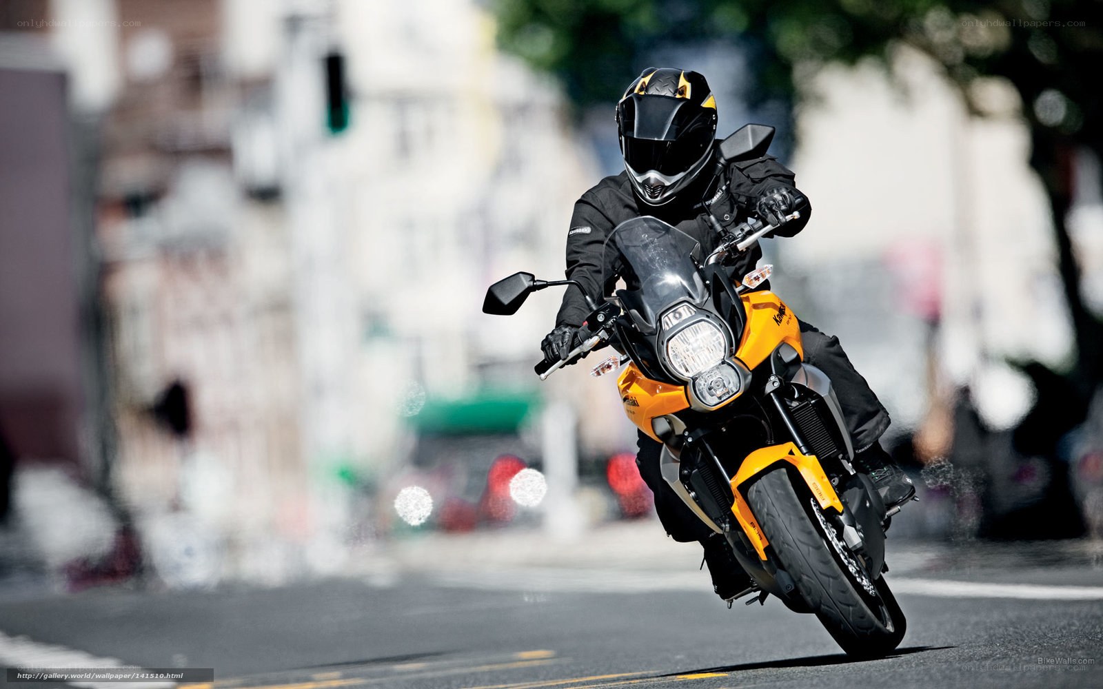 Motorcyclist on a yellow bike