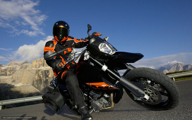 Motorcyclist on Black Bike — Dramatic
