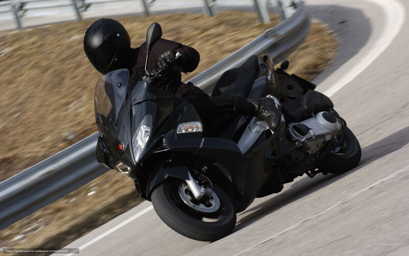 Motorcyclist on Black Scooter