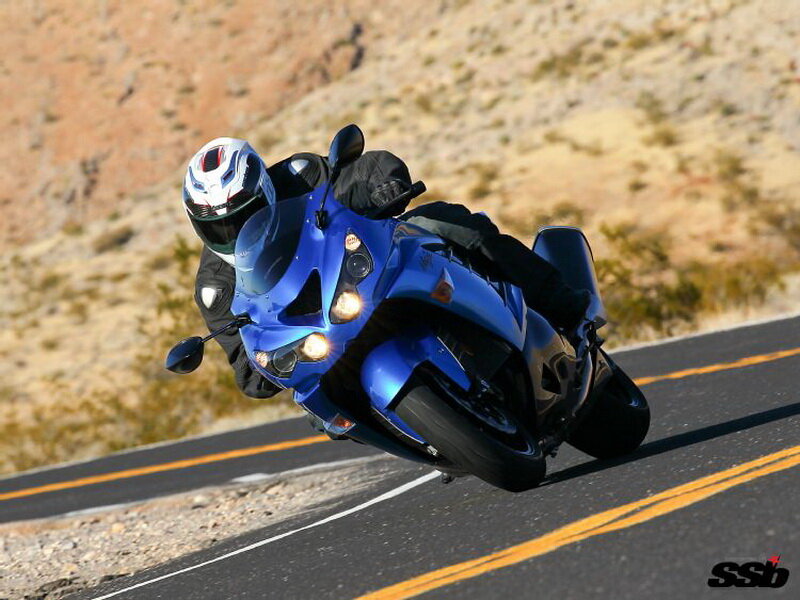 Motorcyclist on Blue Bike — Dynamic, Afternoon, Photograph, Road