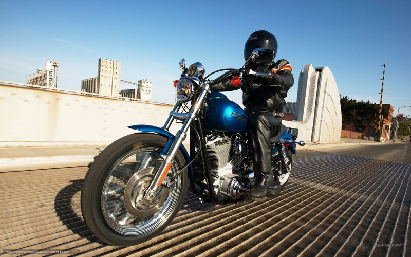 Motorcyclist on Blue Bike — Dynamic, Morning