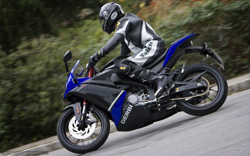 Motorcyclist on Blue Motorcycle