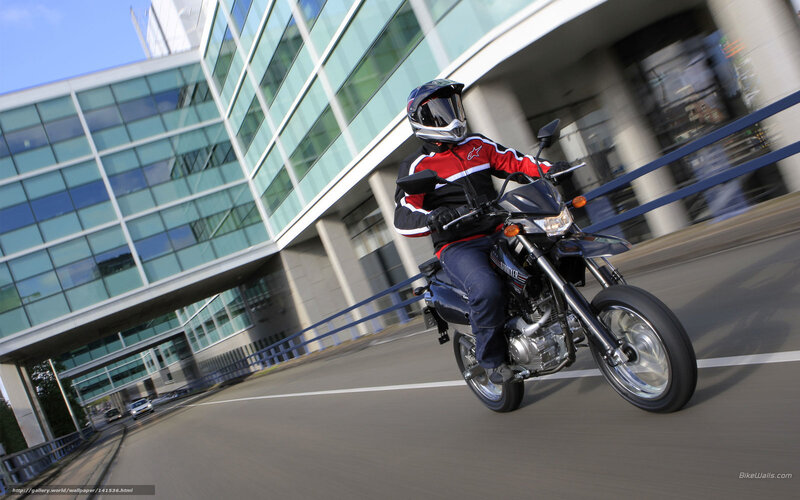 Motorcyclist on City Street — Blue