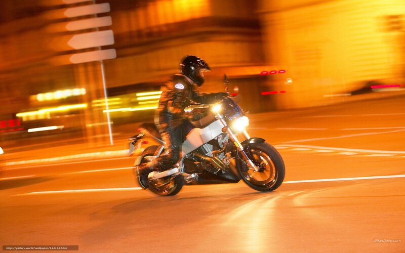 Motorcyclist on City Street — Orange