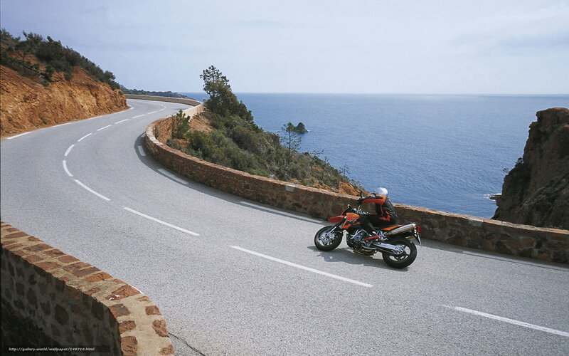 Motorcyclist on coastal road