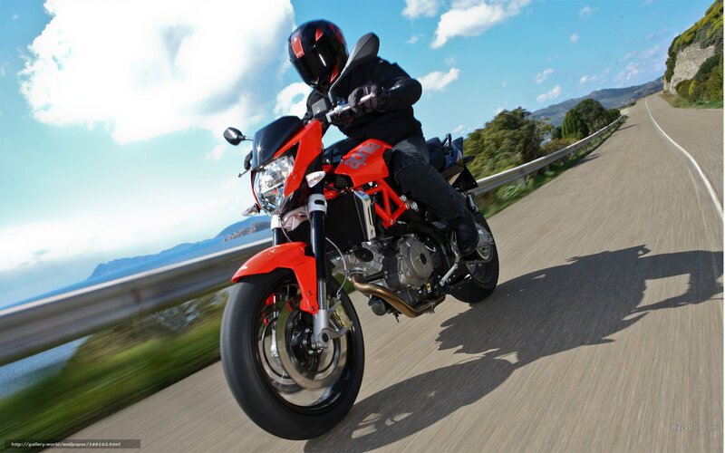 motorcyclist on coastal road