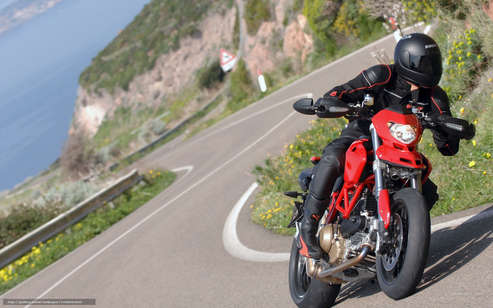 motorcyclist on coastal road