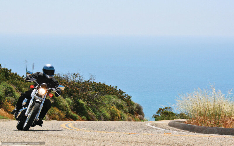 Motorcyclist on coastal road