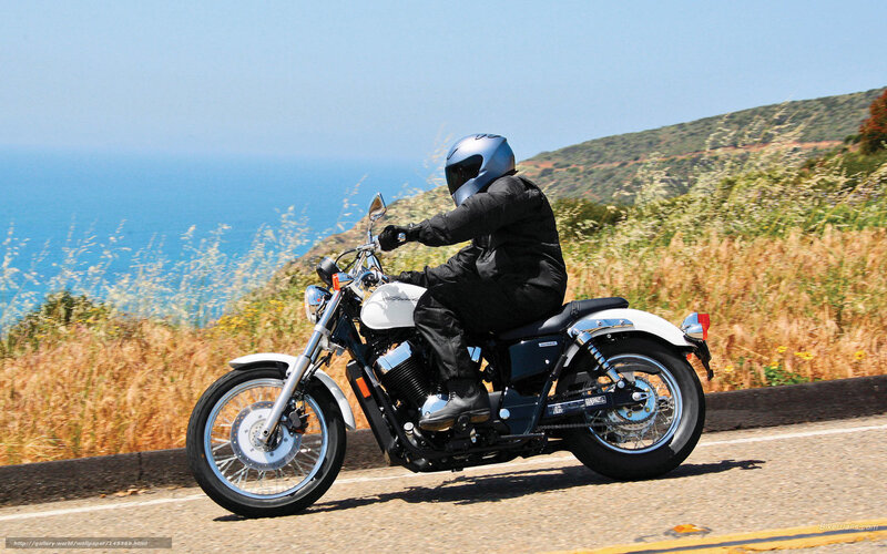 Motorcyclist on Coastal Road — Blue, Serene, Afternoon, Photograph