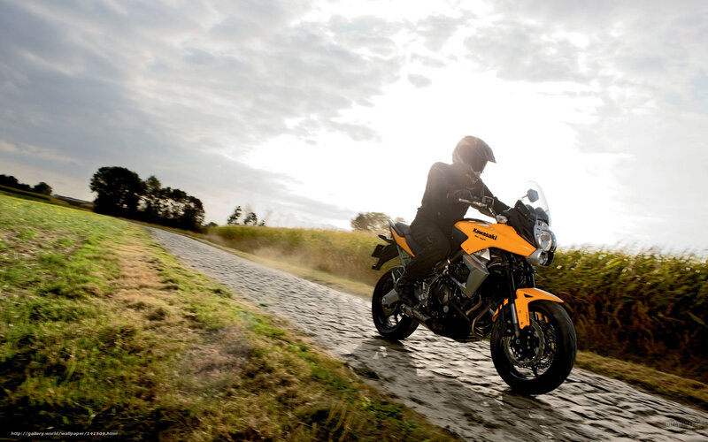 Motorcyclist on Cobblestone Road
