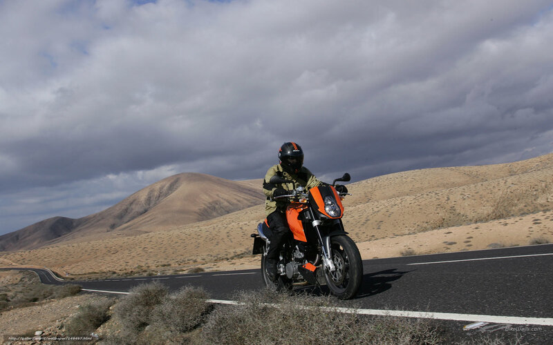 Motorcyclist on Desert Road — Orange