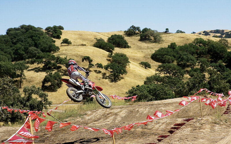 Motorcyclist on Dirt Bike — Brown, Active