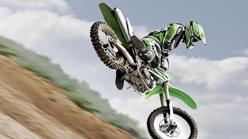 Motorcyclist on Dirt Bike — Green, Dynamic, Afternoon, Photograph, Dirt Track, Helmet